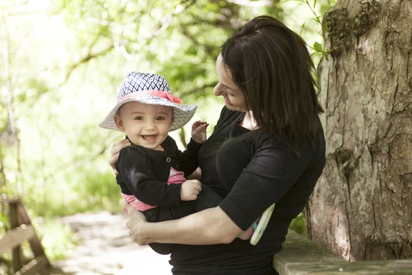 Mother and daughter in forest — Stock Photo, Image