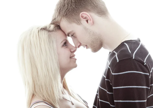 Happy young loving couple embracing, white background — Stock Photo, Image