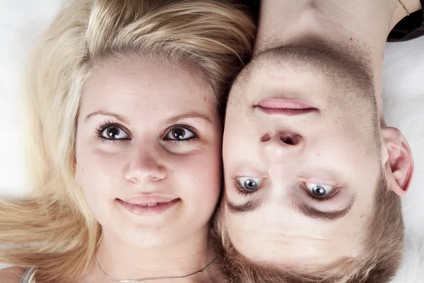 Happy young loving couple embracing, white background — Stock Photo, Image