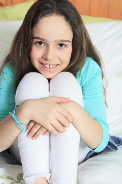 Little girl on bed — Stock Photo, Image