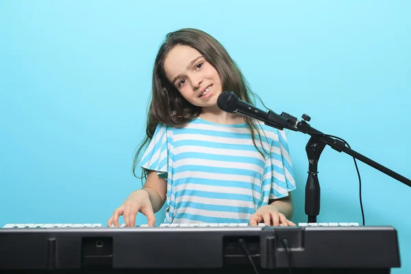 Young girl play digital  piano — Stock Fotó