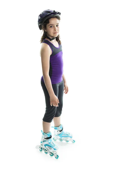 Portrait of girl on rollers skating isolated on white background — Stockfoto