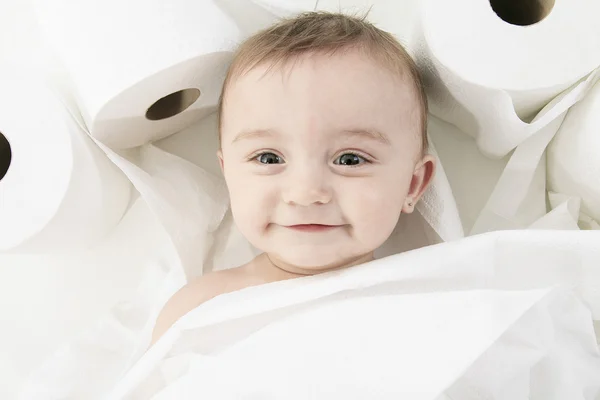 Toddler ripping up toilet paper in bathroom studio — Stock Photo, Image