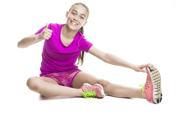Fiatal lány sport cothes, fehér háttérben futó — Stock Fotó