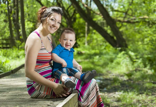 Beautiful mother and little baby boy in forest — Stock Photo, Image