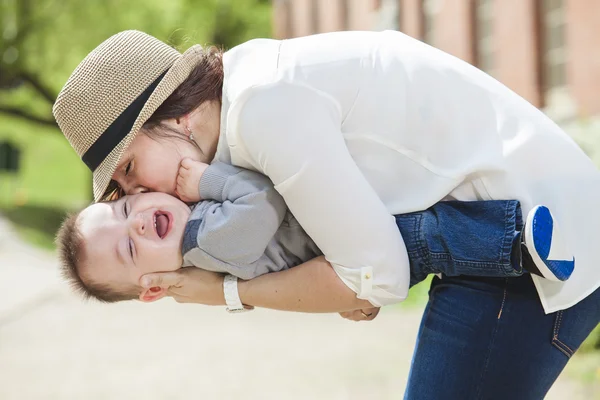 Young mother with her baby boy — Stock Photo, Image