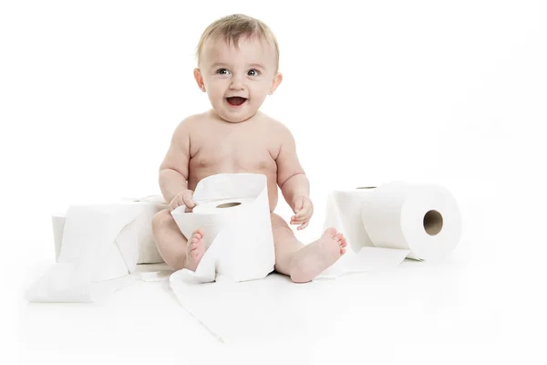 Toddler ripping up toilet paper in bathroom studio — Stock Photo, Image