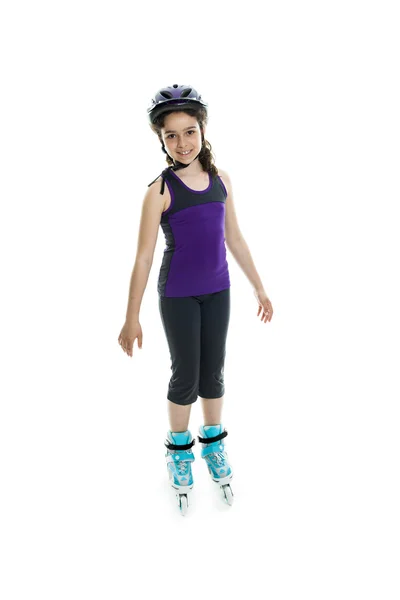 Portrait of girl on rollers skating isolated on white background — Stock fotografie