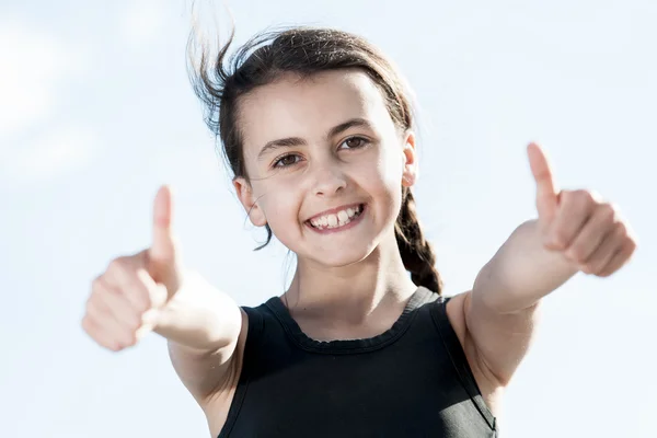 Portrait of young female showing a thumbs up — Stock Photo, Image