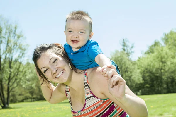 Beautiful mother and little baby boy in forest — Stock Photo, Image