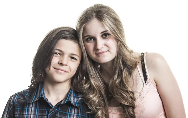 Portrait of girl and a smiling boy on the white background — Stok fotoğraf