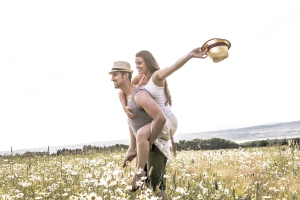 Young couple in love outdoor at the sunset — Stock Photo, Image