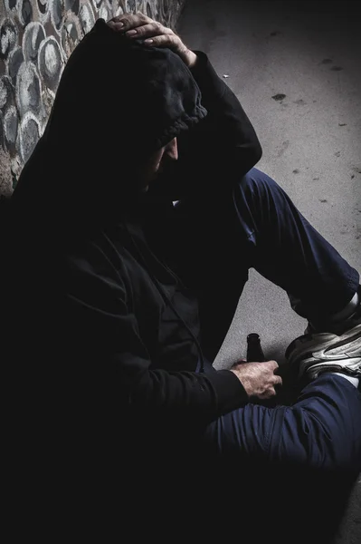 Young man abandoned lost in depression sitting — Stock Photo, Image