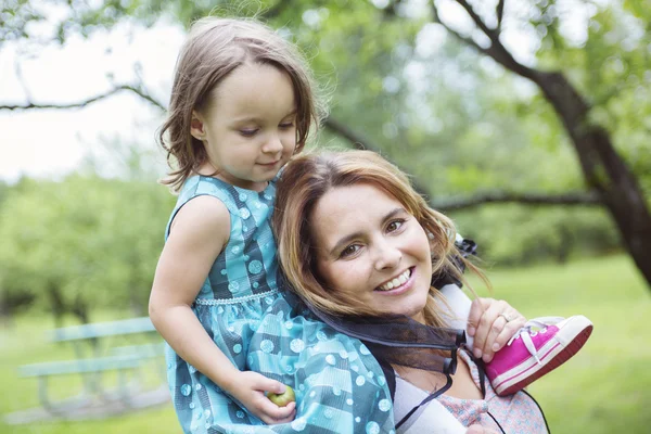 Mother and daughter in forest having fun — Stock Photo, Image