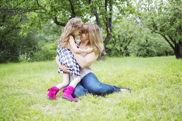 Mother and daughter in forest having fun — Stock Photo, Image