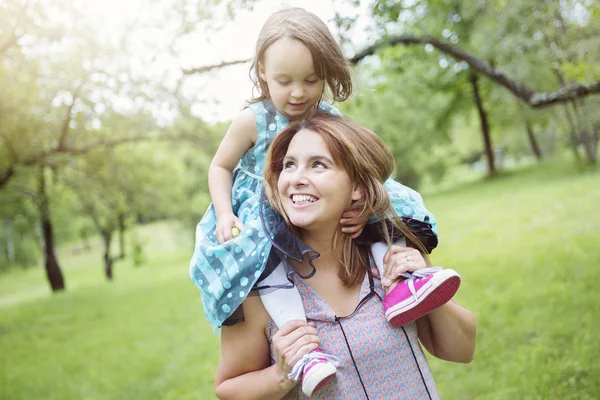 Mother and daughter in forest having fun — Stock Photo, Image