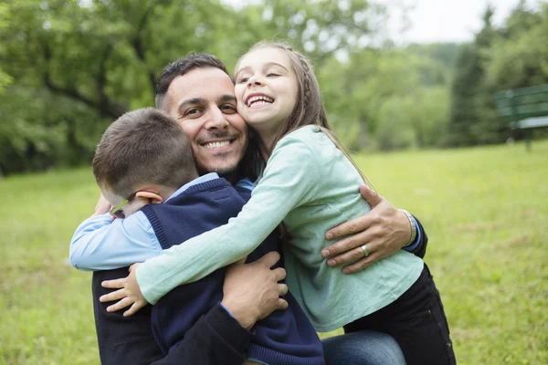 Father and son in forest on a meadow — Stock Photo, Image