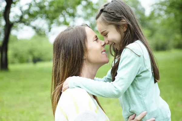 Mother and daughter in forest on a meadow — Stock Photo, Image