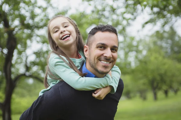 Father and daughter in forest on a meadow — Stock Photo, Image