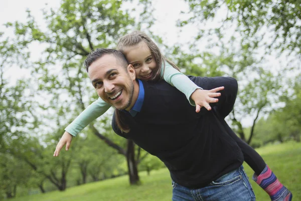 Father and daughter in forest on a meadow — Stock Photo, Image