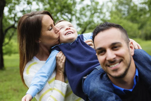 Father mother and son in forest having fun together — Stock Photo, Image
