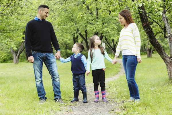 Family in forest having fun together — Stock Photo, Image