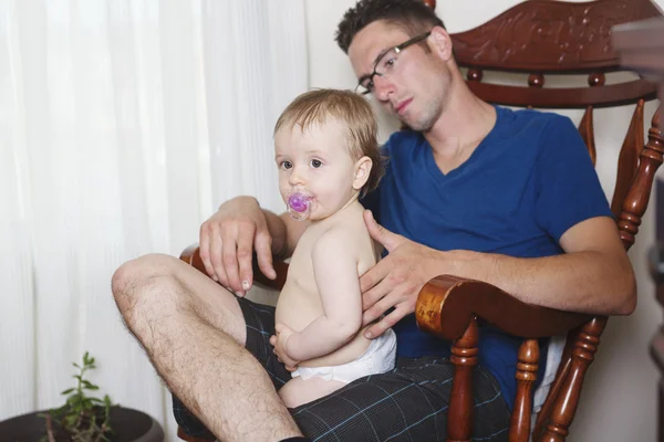 Baby with dad relax on the chair — Stock Photo, Image