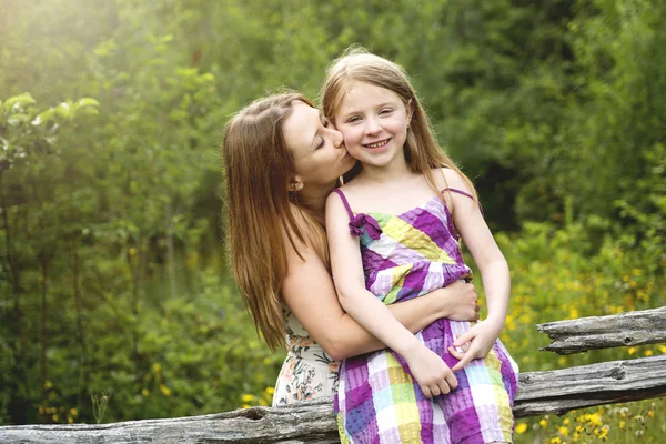 Mother and daughter in forest together — Stock Photo, Image