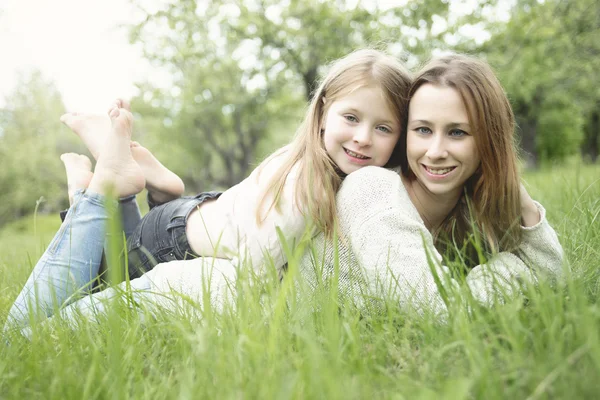 Mother and daughter in forest together — Stock Photo, Image