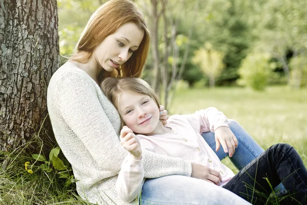 Mother and daughter in forest together — Stock Photo, Image