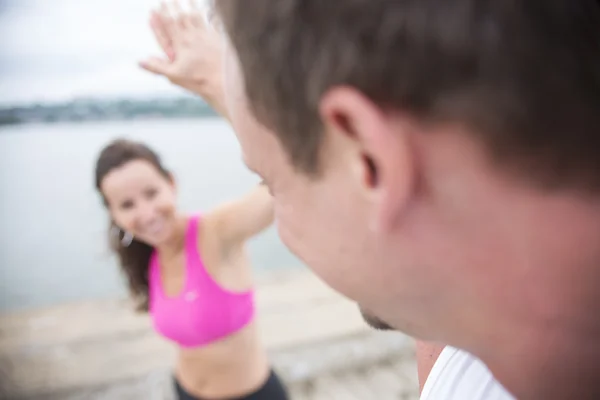 Sport woman and man jogging on road outside. — Stock Photo, Image