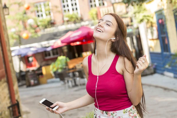 Young happy teenage girl in urban place — Stock Photo, Image