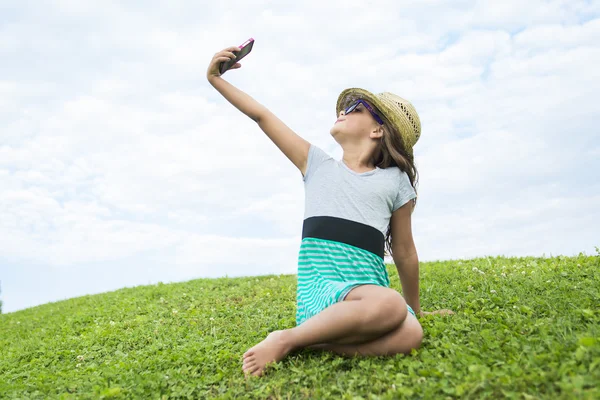 Beautiful portrait of a little girl outside on grass — Stock Photo, Image