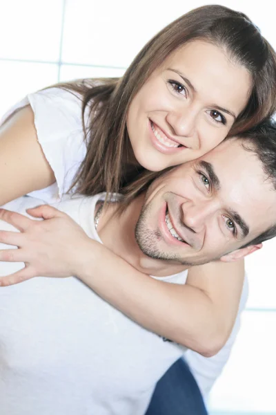 Couple having great time close to the window — Stock Photo, Image