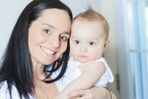 Happy 8 month old baby boy with mother — Stock Photo, Image