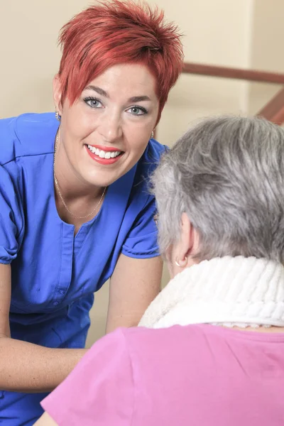 Elderly lady with her physiotherapist in a hospital — Stock Photo, Image