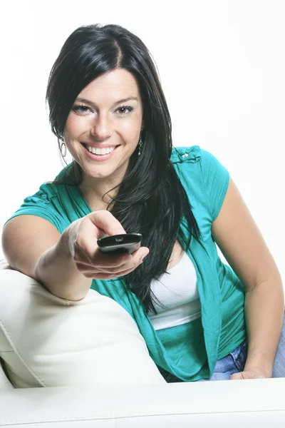 A Beautiful smiling woman relaxing in sofa — Stock Photo, Image