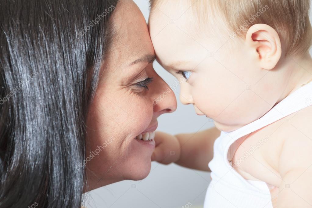 Happy month old baby boy with mother — Stock Photo © Lopolo