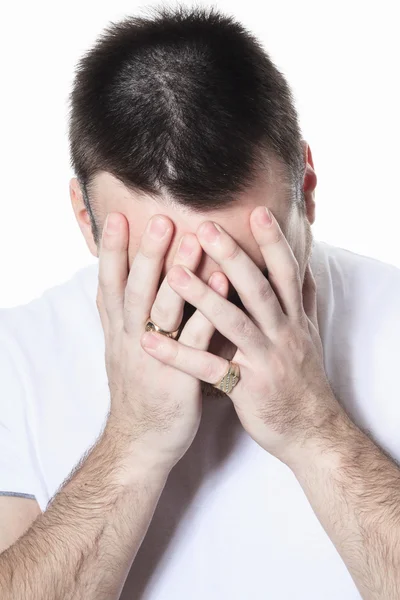 Un hombre que tiene un problema inquietante sobre blanco —  Fotos de Stock