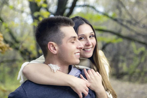 Teen couple at autumn park — Stock Photo, Image