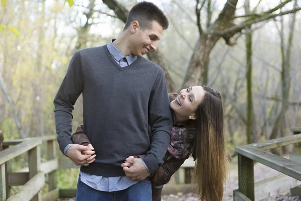 Teen couple at autumn park — Stock Photo, Image