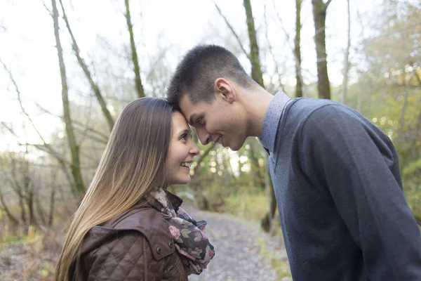 Teen couple at autumn park — Stock Photo, Image