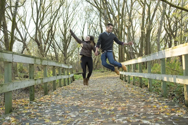 Teen couple at autumn park — Stock Photo, Image