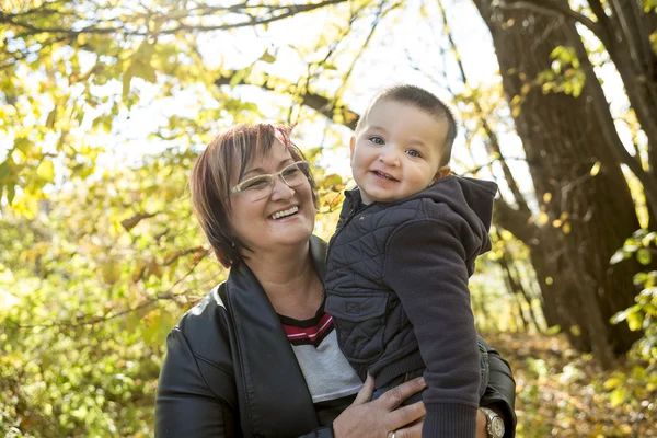 Happy grandma with grandson outdoor — Stock Photo, Image