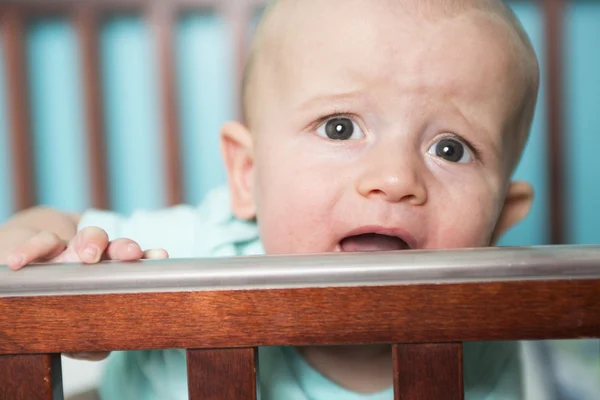 Adorable baby in his crib — Stock Photo, Image