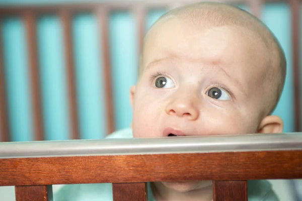 Adorable baby in his crib — Stock Photo, Image