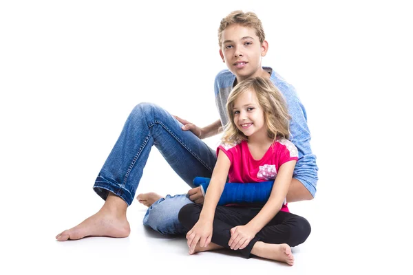 Beautiful children teenager boy with is young sister — Stock Photo, Image