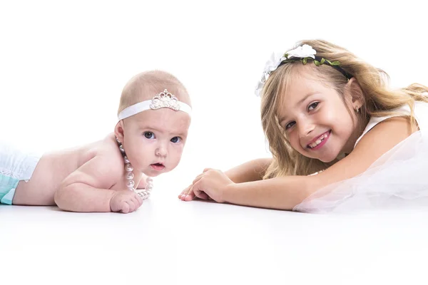 Portrait of two sisters in white dresses — Stock Photo, Image