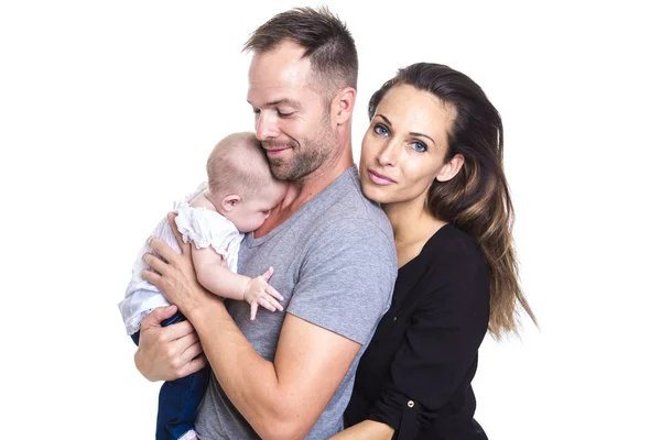 Happy young couple holding a 3 months old baby — Stock Photo, Image