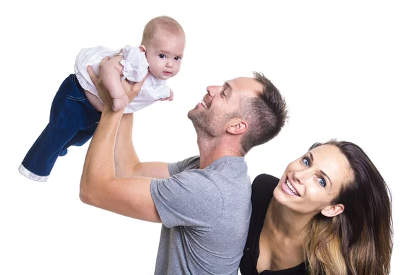 Happy young couple holding a 3 months old baby — Stock Photo, Image